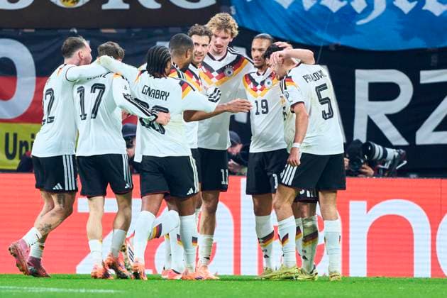 Leroy Sane of Germany celebrates his her goal, happy, laugh, celebration, 3-0 with Nick Woltemade of Germany Leon Goretzka of Germany in the FIFA World Cup, WM, Weltmeisterschaft, Fussball 2026 qualifier match GERMANY - SLOVAKIA in Season 2025 2026 at November 17, 2025 in Leipzig, Germany.