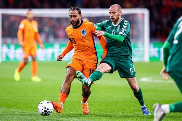 2025-11-17 Netherlands v Lithuania - UEFA World Cup Qualification match AMSTERDAM, NETHERLANDS - NOVEMBER 17: Memphis Depay of Netherlands, Modestas Vorobjovas of Lithuania battle for the ball during the UEFA World Cup Qualification match match between Netherlands and Lithuania at Johan Cruijff ArenA on November 17, 2025 in Amsterdam, Netherlands. Amsterdam Johan Cruijff ArenA Netherlands Content not available for redistribution in The Netherlands directly or indirectly through any third parties. Copyright: xPieterxvanxderxWoudex