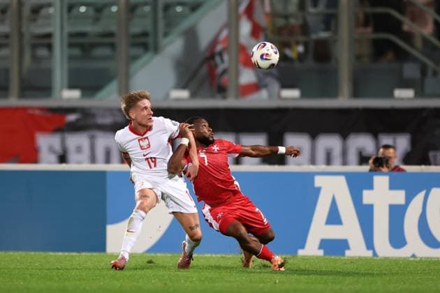 TA QALI 17.11.2025 MECZ 8. KOLEJKA GRUPA G ELIMINACJE DO MISTRZOSTW SWIATA 2026: MALTA - POLSKA --- FIFA World Cup, WM, Weltmeisterschaft, Fussball 2026 QUALIFYING ROUND GROUP G MATCH: MALTA - POLAND MICHAL SKORAS JOSEPH MBONG FOT. PIOTR KUCZA FOTOPYK NEWSPIX.PL --- newspix.pl 