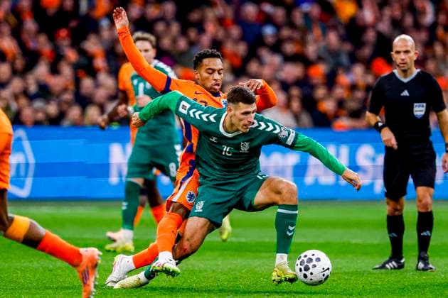 Gvidas Gineitis of Lithuania passes the ball under pressure from Quinten Timber of the Netherlands Netherlands v Lithuania, FIFA World Cup, WM, Weltmeisterschaft, Fussball 2026 Qualifier, Netherlands v Lithuania, Johan Cruijff Arena, November 17, 2025, Amsterdam, Netherlands.
