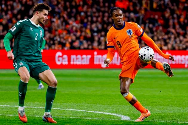 Emmanuel Emegha of the Netherlands dribbles with the ball under pressure from Edgaras Utkus of Lithuania Netherlands v Lithuania, FIFA World Cup, WM, Weltmeisterschaft, Fussball 2026 Qualifier, Netherlands v Lithuania, Johan Cruijff Arena, November 17, 2025, Amsterdam, Netherlands.