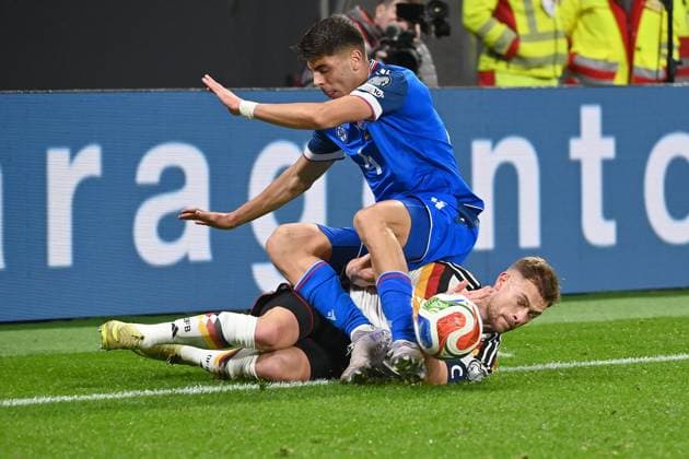 Joshua KIMMICH GER , action,duel against Adam OBERT SVK Soccer international, World Cup Qualification Group A Matchday 06, Germany GER Slovakia SVK on 17 11 2025, RED BULL ARENA Â