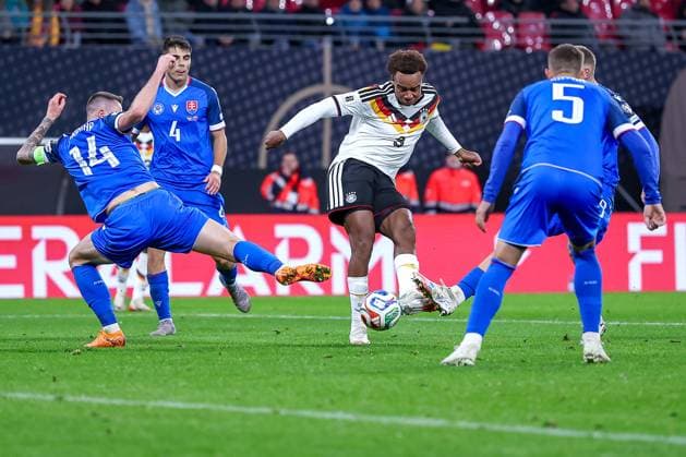 17 11 2025, Football, International match, World Cup Qualification Europe, Germany Slovakia, Red Bull Arena Leipzig , Matchday 10, Season 2025 2026 Goal kick to score 6 0 by scorer Forzan Assan Ouedraogo GER 09 past Milan Skriniar SLK 14 and Lubomir Satka SLK 05 Regulations prohibit any use of photographs as image sequences and or quasi video Sachsen Deutschland