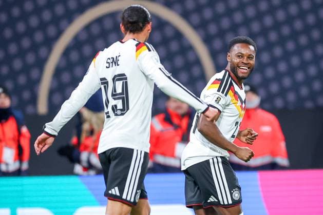17 11 2025, Football, International match, World Cup Qualification Europe, Germany Slovakia, Red Bull Arena Leipzig , Matchday 10, Season 2025 2026 Goal celebration after the goal to 5 0 by scorer Ridle Baku GER 23 next to Leroy Sane GER 19 Regulations prohibit any use of photographs as image sequences and or quasi video Saxony Germany