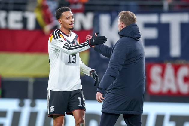 17 11 2025, Football, International match, World Cup Qualification Europe, Germany Slovakia, Red Bull Arena Leipzig , Matchday 10, Season 2025 2026 Joy after the 6 0 victory of the German team Final celebration Felix Nmecha GER 13 hugs national coach Julian Nagelsmann GER hc Regulations prohibit any use of photographs as image sequences and or quasi video Sachsen Deutschland