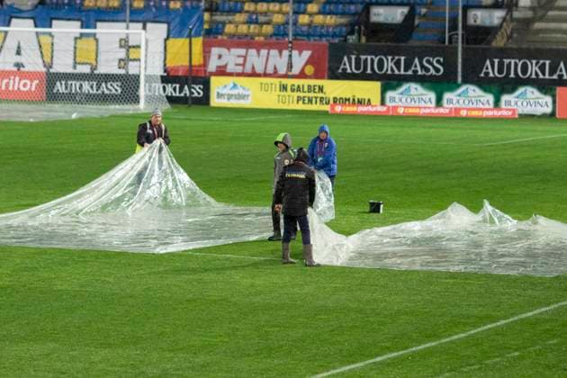 November 18, 2025, FIFA World Cup, WM, Weltmeisterschaft, Fussball Qualifier, Qualifying round, Matchday 10, Group H, Romania vs San Marino,Stadionul Ilie Oana, Ploiesti, Romania Workers protect the pich with plastic sheet befor the start of the game.