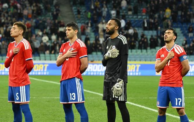 Russia Soccer Friendly Chile - Peru 9049826 18.11.2025 Chile s Ivan Roman, Benjamin Kuscevic, goalkeeper Lawrence Vigouroux and Gabriel Suazo listen to national anthem before the friendly soccer match between Chile and Peru at the Fisht Olympic Stadium, in the Sirius Federal Territory, Krasnodar Region, Russia. Ekaterina Lyzlova Sputnik Sochi Russia  Copyright: xEkaterinaxLyzlovax