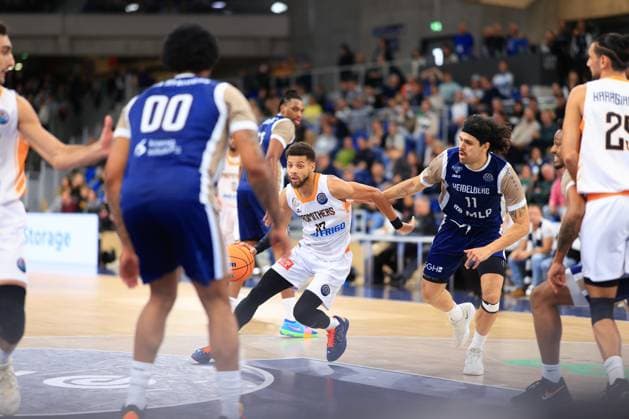 Game scene with Erol Ersek 11 MLP Academics Heidelberg , Kendale McCullum 10 Promitheas Patras Vikos Cola and Osun Osunniyi 12 MLP Academics Heidelberg Basketball Champions League MLP Academics Heidelberg vs Promitheas Patras Vikos Cola Copyright: xspeedshotx