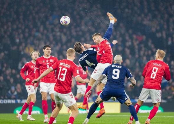 Scott McTominay of Scotland scores with an overhead kick, under pressure fromJoachim Andersen of Denmark, to give Scotland a 1-0 lead. Scotland v Denmark, FIFA 2026 World Cup Qualifying, Group C, Football, Hampden Park, Glasgow, Scotland, UK - 18 Nov 2025Glasgow Hampden Park United Kingdom EDITORIAL USE ONLY No use with unauthorised audio, video, data, fixture lists, club league logos or live services. Online in-match use limited to 120 images, no video emulation. No use in betting, games or single club league player publications. Copyright: xStuartxWallace Shutterstockx 15846619e