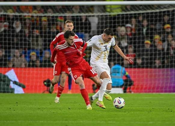18th November 2025; Cardiff City Stadium, Cardiff, Wales; FIFA World Cup, WM, Weltmeisterschaft, Fussball Qualifying International Football, Wales versus North Macedonia; Liam Cullen of Wales tackles Stefan Ashkovski of North Macedonia  AledxHopkins