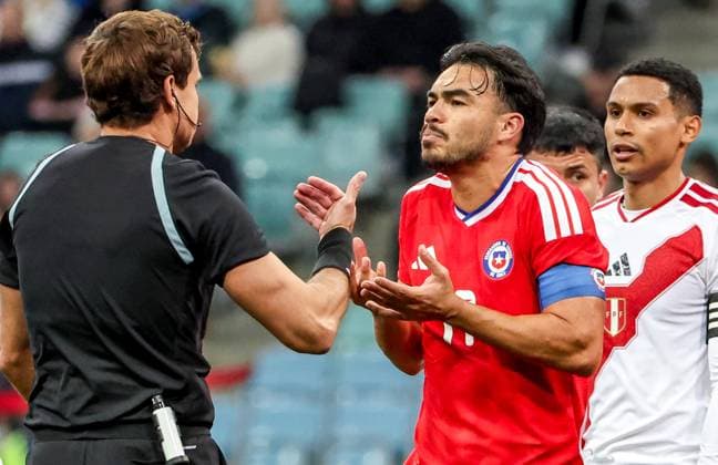 RUSSIA, SOCHI - NOVEMBER 18, 2025: Chile s Gabriel Suazo (R) argues with chief referee Kirill Levnikov in a friendly football match between the Chilean and the Peruvian men s national football teams at Fisht Stadium. Dmitry Feoktistov TASS  85774203