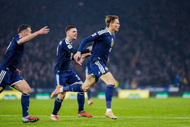 Scott McTominay of Scotland celebrates scoring to give Scotland a 1-0 lead, chased by John McGinn & Andy Robertson of Scotland. Scotland v Denmark, FIFA 2026 World Cup Qualifying, Group C, Football, Hampden Park, Glasgow, Scotland, UK - 18 Nov 2025Glasgow Hampden Park United Kingdom EDITORIAL USE ONLY No use with unauthorised audio, video, data, fixture lists, club league logos or live services. Online in-match use limited to 120 images, no video emulation. No use in betting, games or single club league player publications. Copyright: xStuartxWallace Shutterstockx 15846619u