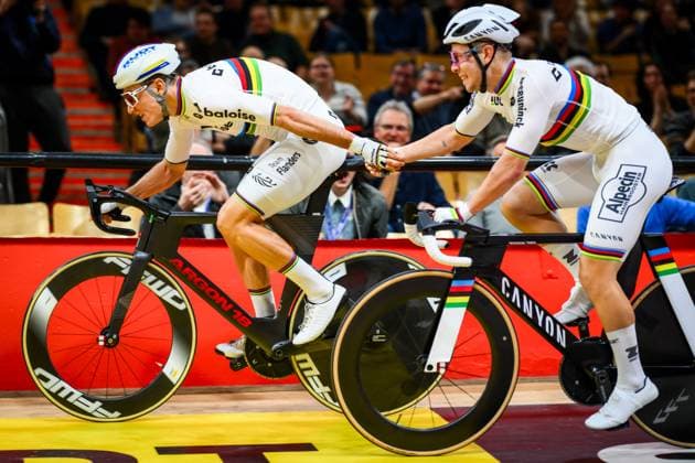 Belgian Lindsay De Vylder and Belgian Fabio Van Den Bossche pictured in action during the first day of the Zesdaagse Vlaanderen-Gent six-day indoor Track cycling, Rad, Radsport, Bahnrad, Bahn event at the indoor cycling arena t Kuipke, Tuesday 18 November 2025, in Gent. DAVIDxPINTENS  x142529121x