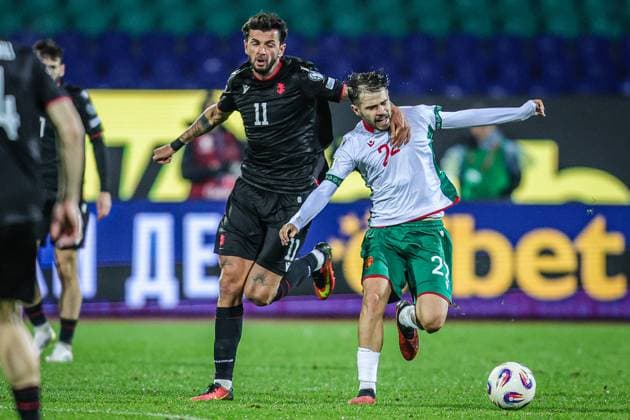 Football - World Cup Qualifiers - Group Stage - Group E - Bulgaria - Georgia - 18.11.2025 Kristiyan Stoyanov of Bulgaria and Giorgi Kvilitaia of Georgia in action during World Cup Qualifiers, Group Stage, Group E between Bulgaria and Georgia Bulgaria Copyright: xYulianxTodorovx
