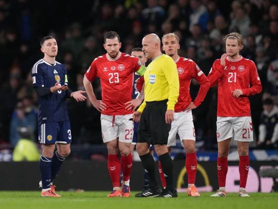 Andy Robertson of Scotland speaks to Referee Szymon Marciniak as they wait for VAR review for possible penalty kick to Denmark. Scotland v Denmark, FIFA 2026 World Cup Qualifying, Group C, Football, Hampden Park, Glasgow, Scotland, UK - 18 Nov 2025Glasgow Hampden Park United Kingdom EDITORIAL USE ONLY No use with unauthorised audio, video, data, fixture lists, club league logos or live services. Online in-match use limited to 120 images, no video emulation. No use in betting, games or single club league player publications. Copyright: xStuartxWallace Shutterstockx 15846619ad