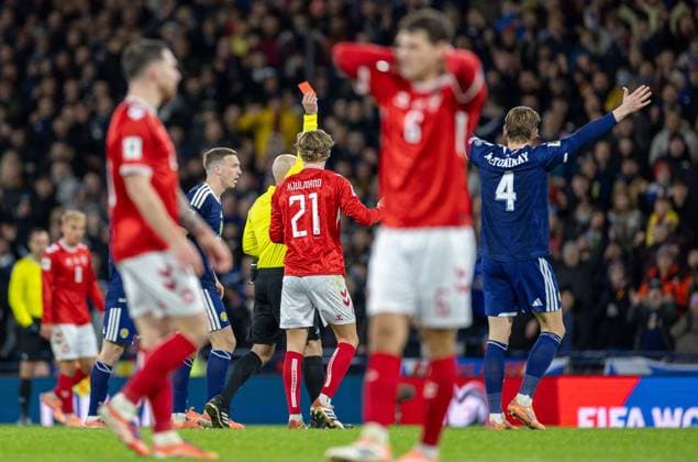 18th November 2025; Hampden Park, Glasgow, Scotland; FIFA World Cup, WM, Weltmeisterschaft, Fussball Qualifiers International Football, Scotland versus Denmark; Referee Szymon Marciniak sends off Rasmus Kristensen of Denmark in the 62nd minute  VagelisxGeorgariou