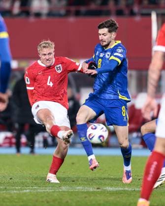 SOCCER - FIFA WC quali, AUT vs BIH VIENNA,AUSTRIA,18.NOV.25 - FIFA World Cup, WM, Weltmeisterschaft, Fussball 2026, European Qualifiers, group stage, OEFB international match, Länderspiel, Nationalmannschaft Austria vs Bosnia and Herzegovina. Image shows Xaver Schlager (AUT) and Armin Gigovic (BIH).  GEPAxpictures xArminxRauthner