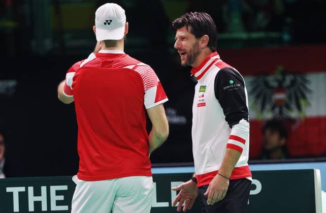 TENNIS - Davis Cup Final 8 BOLOGNA,ITALY,19.NOV.25 - TENNIS - ITF Davis Cup, Final 8, Italy vs Austria. Image shows Jurij Rodionov and captain Juergen Melzer (AUT).  GEPAxpictures xMatthiasxHauer