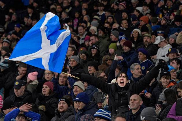 Scotland v Denmark 2026 FIFA World Cup, WM, Weltmeisterschaft, Fussball Qualifiers Fan of Scotland waves a flag at full time during the 2026 FIFA World Cup Qualifiers Group C match at Hampden Park, Glasgow UK Newspapers OUT Copyright: xJamiexJohnstonx FIL-22514-0211