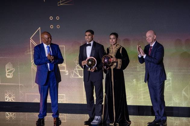 CAF Awards 2025 SALE, MOROCCO - NOVEMBER 19: Paris Saint-Germain’s Moroccan player Achraf Hakimi (2nd L) receives the African Footballer of the Year award and Al-Hilal Saudi s Moroccan player Ghizlane Chebbak (2nd R) receives the African Women s Footballer of the Year during the CAF Awards ceremony in Sale, Morocco on November 19, 2025. FIFA President Gianni Infantino (R) and Confederation of African Football (CAF) President Patrice Motsepe (L) attended the event. Abu Adem Muhammed Anadolu Sale Morocco. Editorial use only. Please get in touch for any other usage.  Copyright: x2025xAnadoluxAbuxAdemxMuhammedx