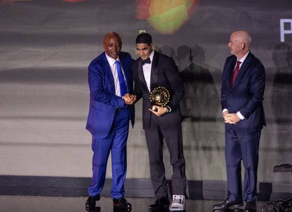 Achraf Hakimi wins African Footballer of the Year award SALE, MOROCCO - NOVEMBER 19: Paris Saint-Germain’s Moroccan player Achraf Hakimi (C) receives the African Footballer of the Year award during the CAF Awards ceremony in Sale, Morocco on November 19, 2025. FIFA President Gianni Infantino (R) and Confederation of African Football (CAF) President Patrice Motsepe (L) attended the event. Abu Adem Muhammed Anadolu Sale Morocco. Editorial use only. Please get in touch for any other usage.  Copyright: x2025xAnadoluxAbuxAdemxMuhammedx