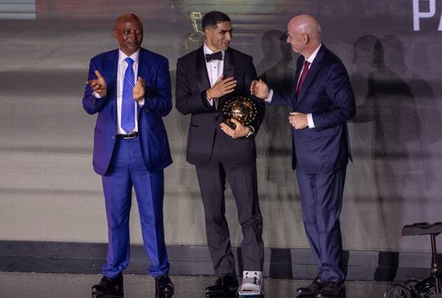 Achraf Hakimi wins African Footballer of the Year award SALE, MOROCCO - NOVEMBER 19: Paris Saint-Germain’s Moroccan player Achraf Hakimi (C) receives the African Footballer of the Year award during the CAF Awards ceremony in Sale, Morocco on November 19, 2025. FIFA President Gianni Infantino (R) and Confederation of African Football (CAF) President Patrice Motsepe (L) attended the event. Abu Adem Muhammed Anadolu Sale Morocco. Editorial use only. Please get in touch for any other usage.  Copyright: x2025xAnadoluxAbuxAdemxMuhammedx