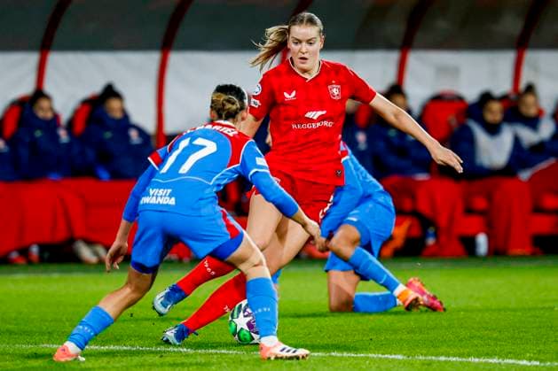 Alieke Tuin of FC Twente dribbles with the ball under pressure from Julia Bartel of Atletico Madrid FC Twente v Club Atletico de Madrid, UEFA Women s Champions League 2025 26 League Phase MD4, FC Twente v Club Atletico de Madrid, FC Twente Stadion, November 20, 2025, Enschede, Netherlands.