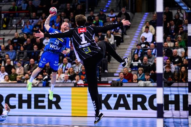 TVB Stuttgart GWD Minden Handball 1 Bundesliga, Men, Season 2025 2026, TVB Stuttgart GWD Minden, Porsche Arena Stuttgarts Patrick Zieker l in action against Mindens goalkeeper Malte Semisch r Stuttgart Porsche Arena Baden Württemberg Germany