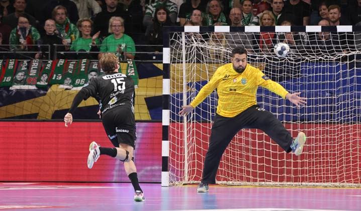 Tobias Schjoelberg Groendahl scores a goal against goalkeeper Mohamed Aly Abdelmotaleb duel Match scene Action Sport Handball CL Champions League Champions League Men 8 Matchday Season 2025 2026 20 11 2025 Füchse Berlin vs Sporting CP Lisbon LCP in the Max Schmeling Halle
