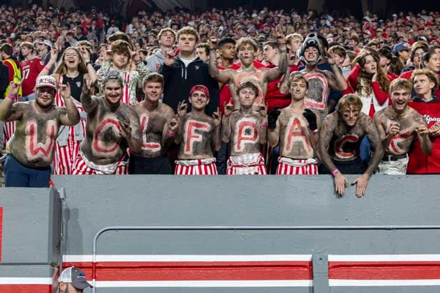 November 21, 2025, Raleigh, North Carolina, USA: NC State Wolfpack fans with body paint cheer on their team during the first half of the NCAA, College League, USA football game between the Florida State Seminoles and the NC State Wolfpack on November 21st, 2025 at Carter-Finley Stadium in Raleigh, NC. Raleigh USA - ZUMAa220 20251121_znp_a220_035 Copyright: xIsraelxAntax