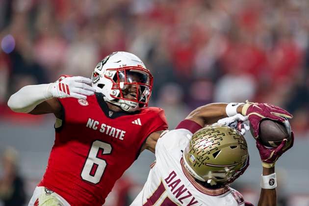 November 21, 2025, Raleigh, North Carolina, USA: NC State Wolfpack defensive back DEVON MARSHALL (6) knocks the ball out of Florida State Seminoles wide receiver MICAHI DANZY (19) hands causing an incomplete pass during the first half of the NCAA, College League, USA football game between the Florida State Seminoles and the NC State Wolfpack on November 21st, 2025 at Carter-Finley Stadium in Raleigh, NC. Raleigh USA - ZUMAa220 20251121_znp_a220_048 Copyright: xIsraelxAntax