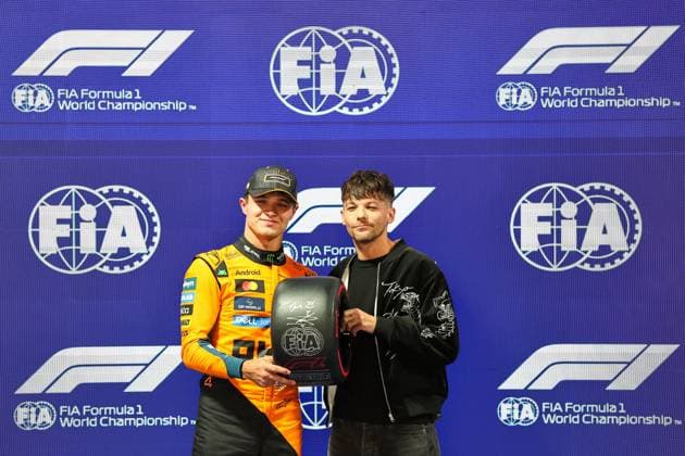 (251122) -- LAS VEGAS, Nov. 22, 2025 -- First-placed McLaren s British driver Lando Norris (L) poses on the podium after the qualifying session of the 2025 Formula One U.S. Grand Prix at Las Vegas Circuit, in Las Vegas, the United States, Nov. 21, 2025. (Photo by Xinhua) (SP)U.S.-LAS VEGAS-F1-GRAND PRIX-QUALIFYING SESSION QianxJun 