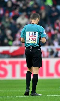 Referee Referee Sven Jablonski with advertisement for UEFA Women EURO 2029 as candidate FC Bayern Muenchen SC Freiburg SCF 22 11 2025 DFL REGULATIONS PROHIBIT ANY USE OF PHOTOGRAPHS AS IMAGE SEQUENCES AND OR QUASI VIDEO FC Bayern Muenchen SC Freiburg SCF