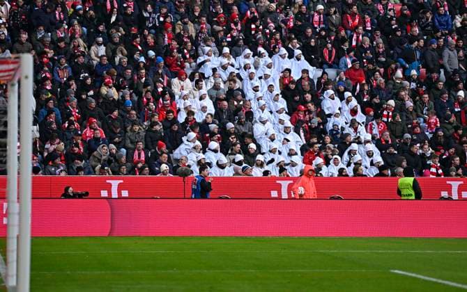 22 11 2025, Soccer Bundesliga 2025 2026, 11 Matchday, FC Bayern Munich SC Freiburg, in the Allianz Arena Munich, The Telekom logo upside down, the background to the campaign is the launch of the fifth and final Netflix hit series ãStranger ThingsÒ, which starts at the end of November on Magenta TV DFL and DFB regulations prohibit any use of photographs as image sequences and or quasi video