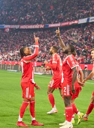 Dayot Upamecano of FC Bayern München celebrates his 3-2 goal, happy, laugh, celebration, with Michael Olise of FC Bayern München in the match FC BAYERN MÜNCHEN - SC FREIBURG on November 22, 2025 at Allianz Arena München, Germany. Season 2026 2026, 1.Bundesliga, FCB, matchday 11,