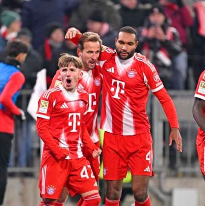 22 11 2025, Soccer Bundesliga 2025 2026, Matchday 11, FC Bayern Munich SC Freiburg, in the Allianz Arena Munich, Goal celebration f l Lennart Karl FC Bayern Munich , Harry Kane FC Bayern Munich , and Jonathan Tah FC Bayern Munich DFL and DFB regulations prohibit any use of photographs as image sequences and or quasi video