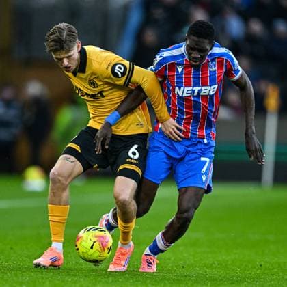 22nd November 2025; Molineux Stadium, Wolverhampton, West Midlands, England; Premier League Football, Wolverhampton Wanderers versus Crystal Palace; David Moller Wolfe of Wolverhampton Wanderers holds off Ismaila Sarr of Crystal Palace  GodfreyxPitt