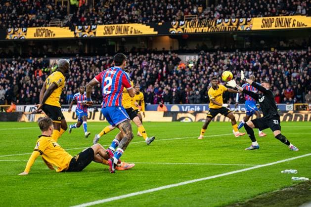 22nd November 2025; Molineux Stadium, Wolverhampton, West Midlands, England; Premier League Football, Wolverhampton Wanderers versus Crystal Palace; Sam Johnstone of Wolverhampton Wanderers parries the ball away from goal from the shot from Daniel Munoz of Crystal Palace  GodfreyxPitt
