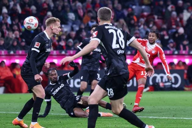 Michael Olise 17 FC Bayern Muenchen with the shot that leads to 6 2, FC Bayern Muenchen vs SC Freiburg, Football, Bundesliga, DFL, Season 2025 2026, Hinrunde, 22 11 2025 DFB regulations prohibit any use of photographs as image sequences and or quasi video Muenchen Bayern Germany Copyright: xkolbert-press MartinxAgüerax