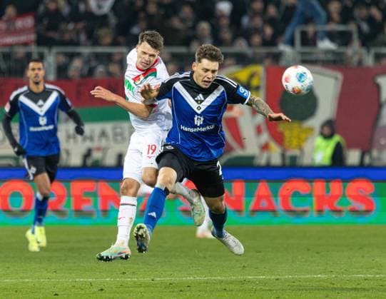 Battle for the ball between Robin Fellhauer FC Augsburg 19 and Nicolai Remberg Hamburger SV FC Augsburg vs Hamburger SV, Matchday 11 DFL REGULATIONS PROHIBIT ANY USE OF PHOTOGRAPHS AS IMAGE SEQUENCES AND OR QUASI VIDEO