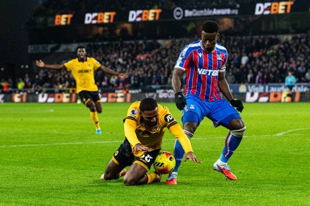 22nd November 2025; Molineux Stadium, Wolverhampton, West Midlands, England; Premier League Football, Wolverhampton Wanderers versus Crystal Palace; Mateus Mane of Wolverhampton Wanderers falls in the penalty area under pressure from Marc Guehi of Crystal Palace  GodfreyxPitt