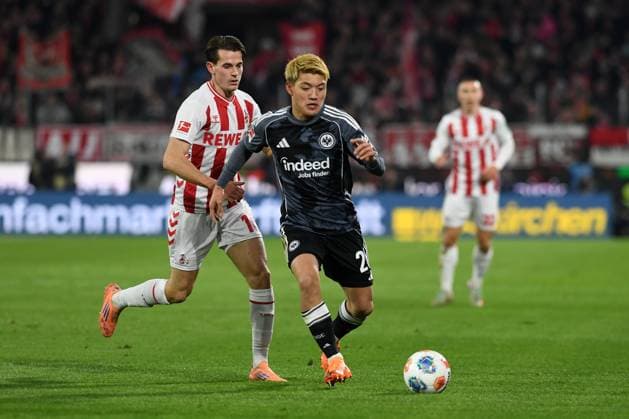 Jakub Kaminski 1 FC Koeln and Ritsu Doan Eintracht Frankfurt battle for the ball during the Bundesliga match between 1 FC Koeln and Eintracht Frankfurt at RheinEnergieSTADION on November 22, 2025 in Cologne, Germany, Germany Photo by Ralf Treese DeFodi Images Jakub Kaminski 1 FC Koeln and Ritsu Doan Eintracht Frankfurt battle for the ball during the Bundesliga match between 1 FC Köln and Eintracht Frankfurt at RheinEnergieSTADION on November 22, 2025 in Köln, Germany Photo by Ralf Treese DeFodi Images DFL regulations prohibit any use of photographs as image sequences and or quasi video Photo by Ralf Treese DeFodi Images