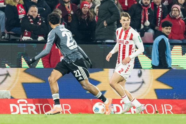 KOELN, GERMANY - NOVEMBER 25: Nathaniel Brown (Eintracht Frankfurt, 21) and Joel Schmied (1. FC Koeln, 2) fight for the ball during the Bundesliga match between 1. FC Koeln vs. Eintracht Frankfurt at Rheinenergie-Stadion on matchday 11 of the 1. Bundesliga on November 22, 2025 in Koeln, Germany. DFL REGULATIONS PROHIBIT ANY USE OF PHOTOGRAPHS AS IMAGE SEQUENCES AND OR QUASI-VIDEO. North Rhine Westphalia Germany Copyright: xBEAUTIFULxSPORTS Wunderlx