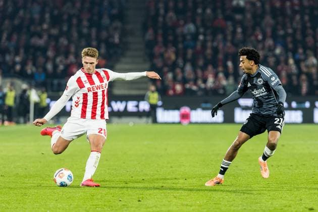 KOELN, GERMANY - NOVEMBER 25: Sebastian Sebulonsen (1. FC Koeln, 28) and Nathaniel Brown (Eintracht Frankfurt, 21) battle for the ball during the Bundesliga match between 1. FC Koeln vs. Eintracht Frankfurt at Rheinenergie-Stadion on matchday 11 of the 1. Bundesliga on November 22, 2025 in Koeln, Germany. DFL REGULATIONS PROHIBIT ANY USE OF PHOTOGRAPHS AS IMAGE SEQUENCES AND OR QUASI-VIDEO. North Rhine Westphalia Germany Copyright: xBEAUTIFULxSPORTS Wunderlx