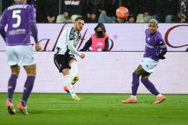 22nd November 2025, Artemio Franchi Stadium, Florence, Italy; Italian Serie A Football; Fiorentina versus Juventus; Filip Kostic of FC Juventus crosses into the Fiorentina box under pressure from Dodo of Fiorentina  AllShotLive