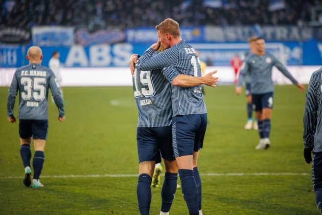 Goal celebration 2 0 left Jan Mejdr Rostock is kissed by scorer Emil Frost Holten Rostock GER, FC Hansa Rostock vs 1 FC Schweinfurth 05, Football, Men, 3 Liga, Matchday 15, Match 2025 2026, 22 11 2025 Rostock Ostseestadion Mecklenburg Vorpommern Germany