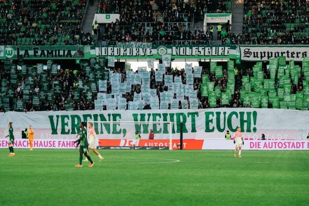 Germany, Football, 1 Bundesliga 2025 26, 11 Matchday VfL Wolfsburg vs Bayer Leverkusen Volkswagen Arena Wolfsburg Fan Project Banner VfL Wolfsburg Home Curve Clubs defend yourselves Copyright: xJamesxZabelx
