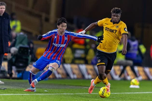 Wolverhampton Wanderers v Crystal Palace Premier League 22 11 2025. Crystal Palace midfielder Daichi Kamada (18) battles for possession with Wolverhampton Wanderers defender Emmanuel Agbadou (12) during the Premier League match between Wolverhampton Wanderers and Crystal Palace at Molineux, Wolverhampton, England on 22 November 2025. Editorial use only DataCo restrictions apply See www.football-dataco.com , Copyright: xManjitxNarotrax PSI-23244-0187
