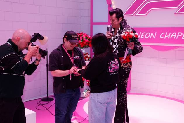 LAS VEGAS, NV - NOVEMBER 22: A couple is married by an Elvis impersonator in the F1 Chapel prior to the the Formula 1 Las Vegas Grand Prix on November 22, 2025 on the Las Vegas Strip Circuit in Las Vegas, Nevada.(Photo by Jeff Speer Icon Sportswire) AUTO: NOV 22 F1 Las Vegas Grand Prix EDITORIAL USE ONLY Icon2511220541