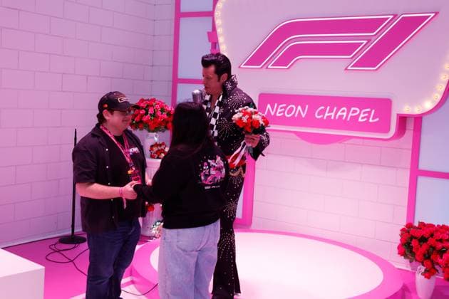 LAS VEGAS, NV - NOVEMBER 22: A couple is married by an Elvis impersonator in the F1 Chapel prior to the the Formula 1 Las Vegas Grand Prix on November 22, 2025 on the Las Vegas Strip Circuit in Las Vegas, Nevada.(Photo by Jeff Speer Icon Sportswire) AUTO: NOV 22 F1 Las Vegas Grand Prix EDITORIAL USE ONLY Icon2511220551